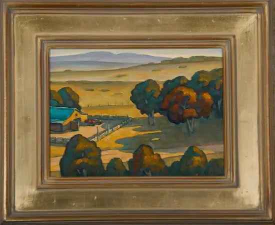 Oil painting of a rural landscape featuring golden fields, distant hills, and a cluster of trees in the foreground, with a small house and fence along a winding path; framed in a gold mat.