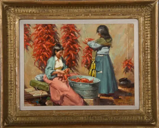 Two women in a courtyard sorting bright red chili peppers; a metal tub is filled with peppers.