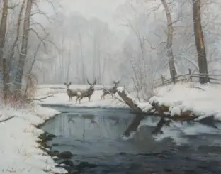 Three deer stand in a snowy forest beside a dark, partially frozen stream with bare trees overhead.