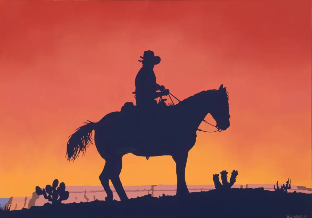 Silhouette of a cowboy riding a horse against an orange sunset in a desert with cacti on the horizon.