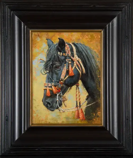 Painting of a black horse's head wearing a decorative bridle with red tassels, set against a warm, yellow-orange background in a thick black frame.
