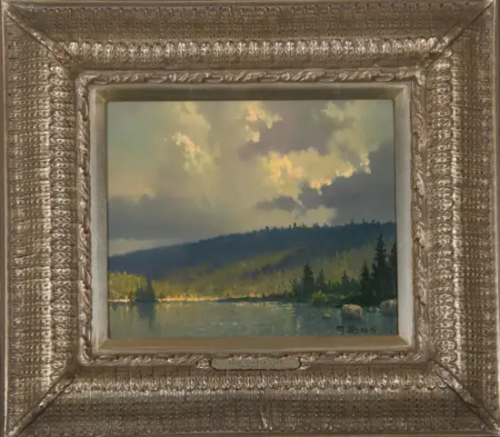 Landscape painting of Bear Canyon Lake with forested hills and a cloudy sky, framed in a silver decorative frame with a plaque.