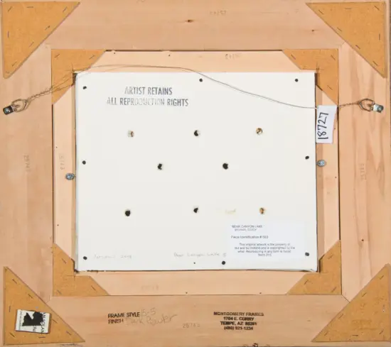 Back of a framed artwork: wooden stretcher bars, hanging wire, and multiple labels, including 'Artist Retains All Reproducing Rights' and a small tag.