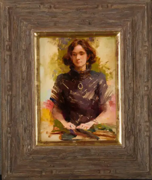 Portrait of a woman with short dark hair, wearing a dark blouse, seated with hands on a surface; painted in an impressionistic style in a carved wooden frame.