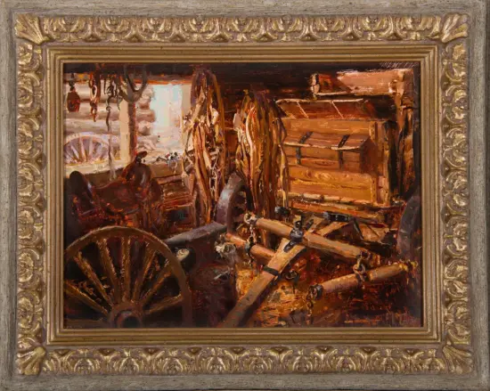 A cluttered 19th-century workshop with wooden wheels, planks, and hauling gear lit by warm light in a carved frame painting frame.