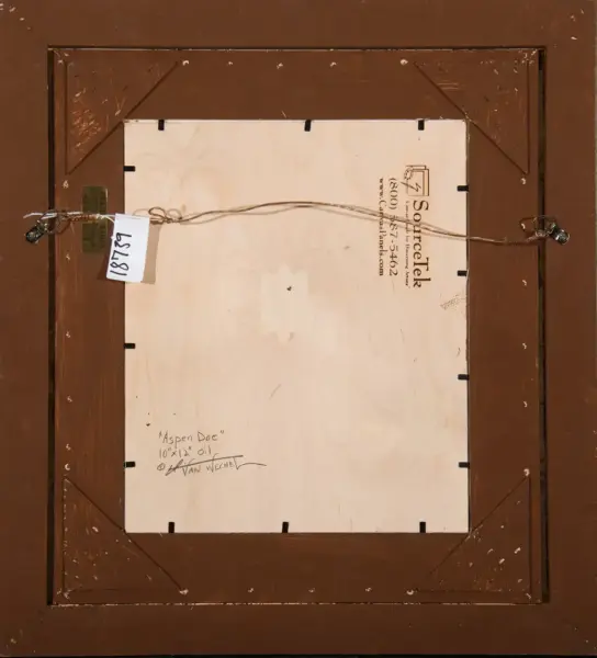 Back of a framed painting, shows hanging wire and label with a tag; handwritten title 'Aspen Doe' and artist signature on the canvas back.
