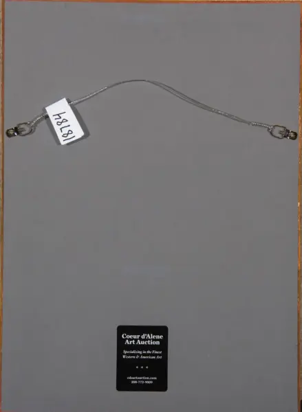 Curved silver chain with end clasps on a gray background, attached to a white tag with handwritten numbers, auction card visible at the bottom.