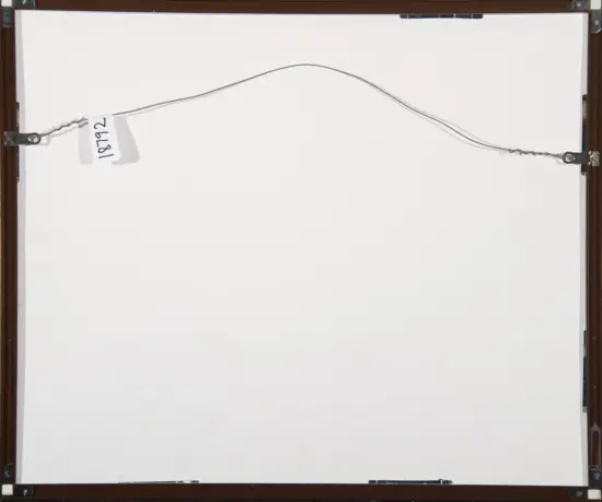 Back view of a framed whiteboard or panel; a thin metal hanging wire runs across the top with a tag reading '1972' attached on the left.