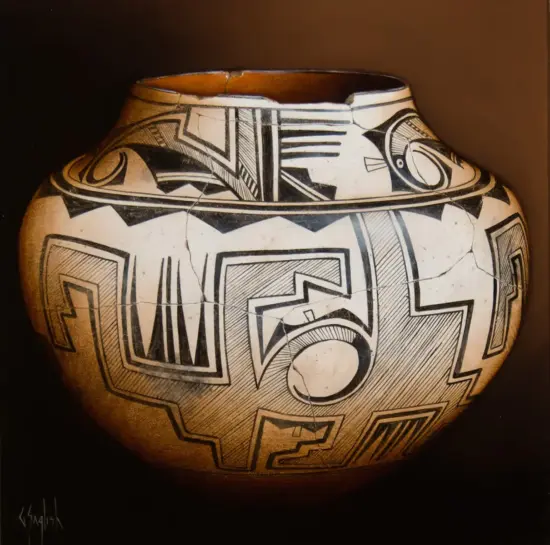 White ceramic vase with bold black geometric patterns wrapping around the surface.