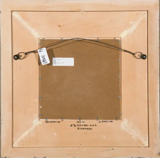 Back of a wooden-framed artwork showing a wire hanging system, with metal loops on both sides and tags attached.