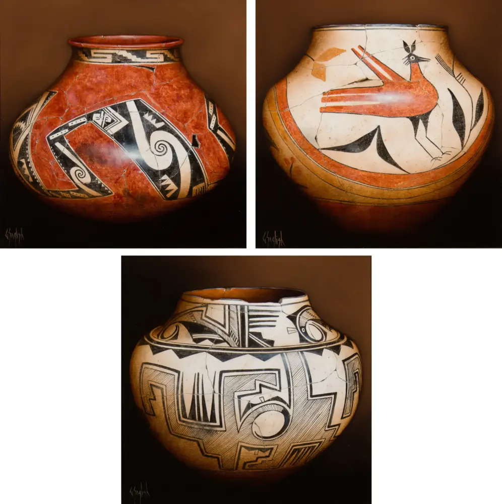 Two ceramic vases shown side by side with bold black-and-red geometric designs on white and red backgrounds; both are cracked but intact sections remain visible.