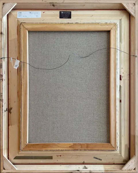 Back of a framed canvas on a wooden stretcher with a hanging wire, labels, and handwritten marks visible on the frame.