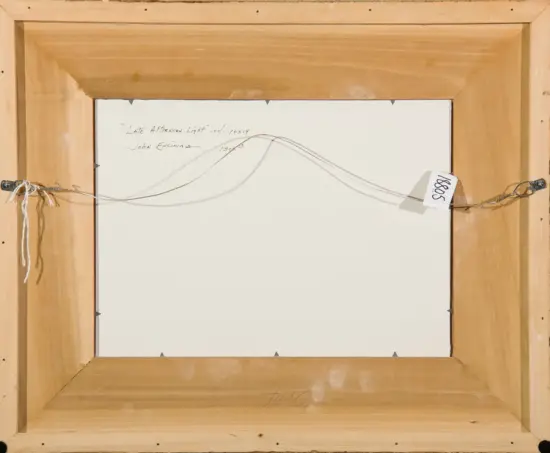 Back of a framed painting: wooden frame, hanging wire, and a white tag labeled 18805; handwritten title reads 'Late Afternoon Light' oil 10x14
