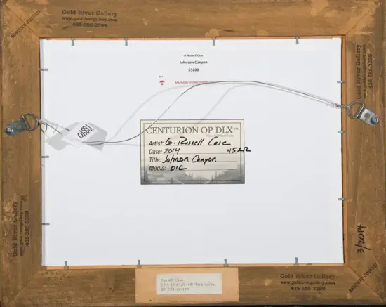 Back of framed artwork with label reading 'Centurion Op DLX' and handwritten details by artist G. Russell Case, Johnson Canyon, oil on panel, 2014/15.