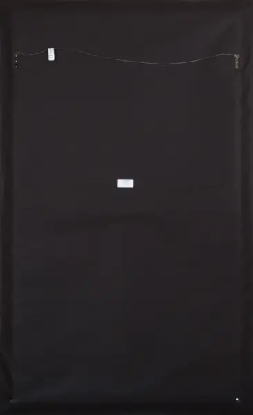 Back of a black picture frame with a thin wire across the top and a small white label in the center.
