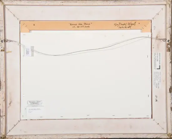 Back of a framed painting showing a wire hanging system, labels, and handwritten notes on the frame (title 'Across the Plaza').
