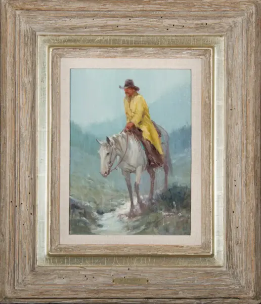 Man in a yellow coat riding a white horse through a misty landscape, framed in a rustic wooden frame.