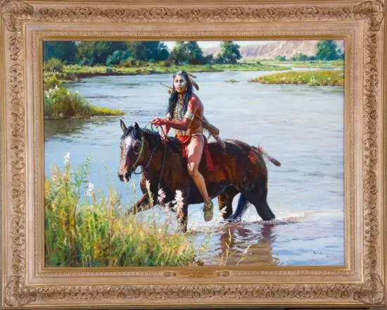 Painting of a Native American man on horseback crossing a shallow river in a lush landscape, framed by an ornate gold frame.