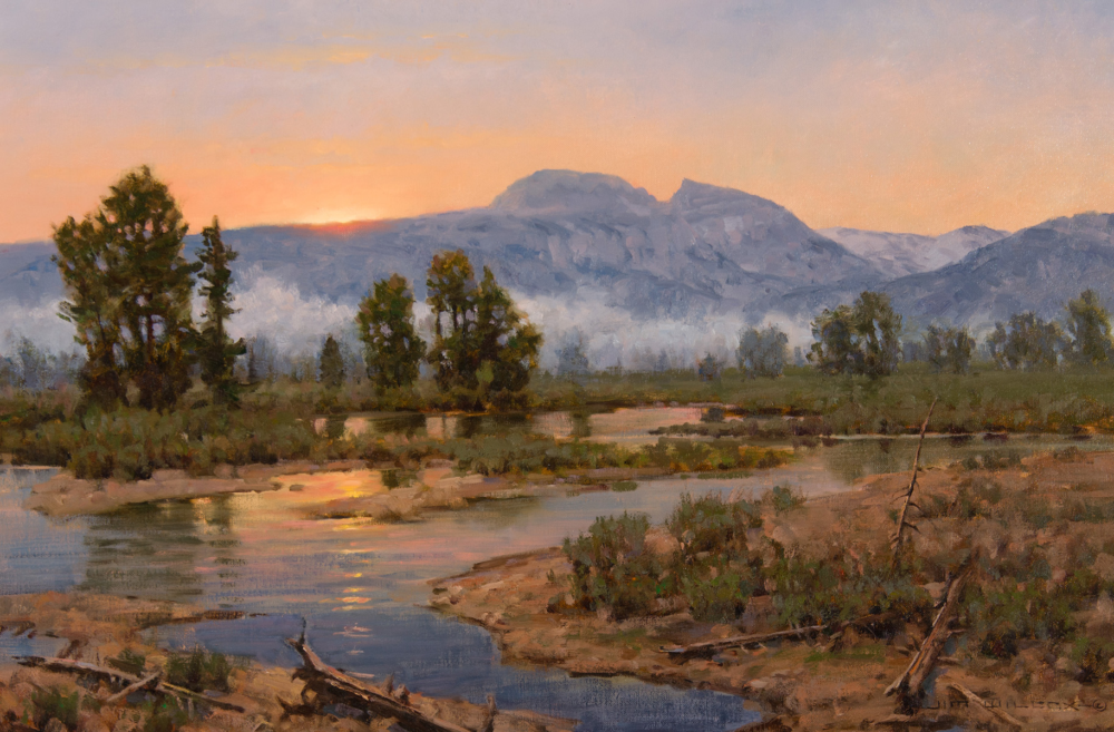 Dusk over a mountain valley: sun setting behind distant peaks, mist over a calm river, with trees along the shoreline.