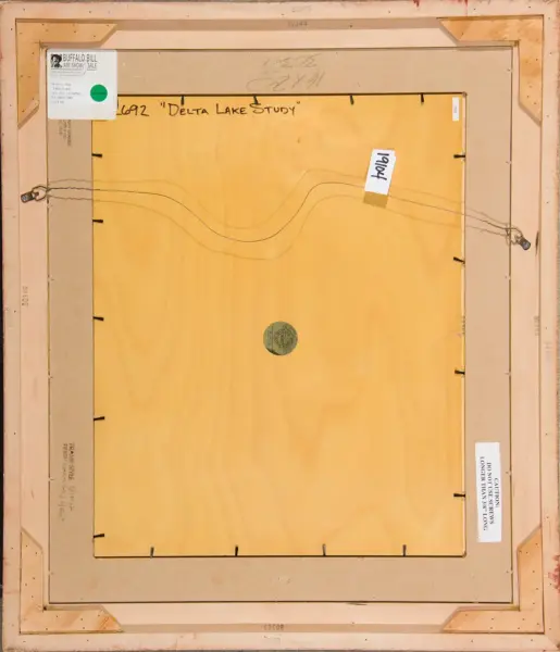 Back of a framed artwork showing hanging wire and labels, with handwritten title 'Delta Lake Study' on the back.
