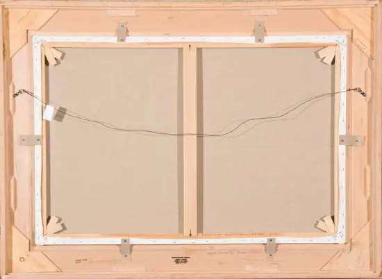 Back of a stretched canvas frame: central vertical support, outer wooden frame, and a hanging wire across the back with metal eyelets and labels nearby.
