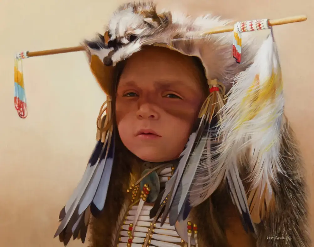 Young child wearing a feathered headdress with beads and ribbons, looking at the camera.