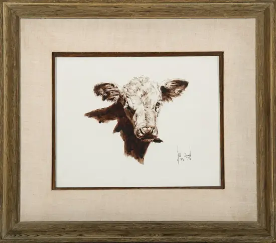 Ink sketch of a cow's head in brown tones, framed with a beige mat and rustic wooden frame (signature bottom right).