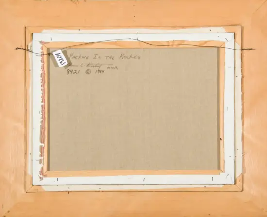 Back of a stretched canvas on a wooden frame; handwritten title 'Packing in the Rockies' with date 1989.