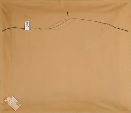 Back of a brown-paper package with a string stretched across the top, a small white tag near the left edge, and a red shipping sticker in the bottom-left corner.