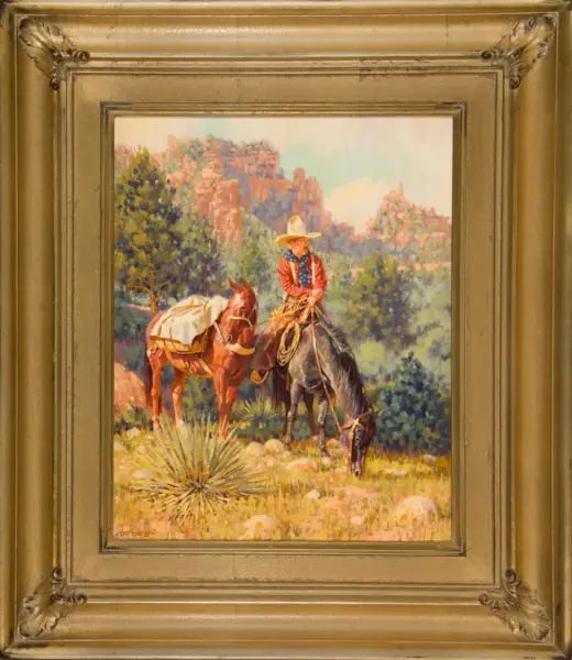 Oil painting of a cowboy in a red shirt and wide-brim hat riding a dark horse, with a second horse nearby, set against a canyon and trees; framed in an ornate gold frame