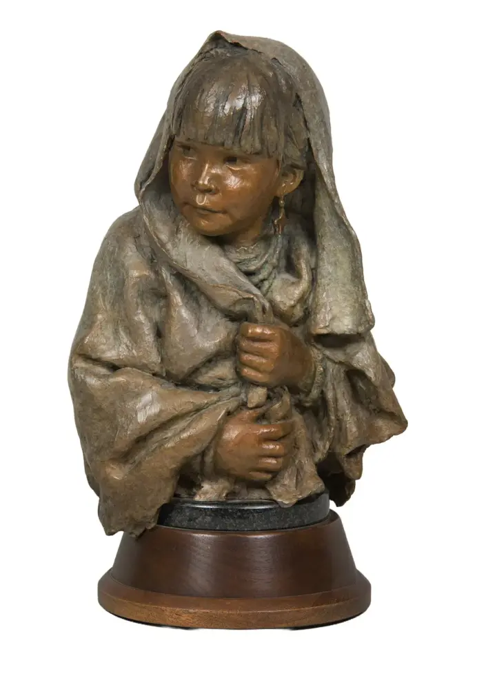 Bronze sculpture of a young girl in a hooded cloak, clasping the edges of her robe, on a wooden pedestal.