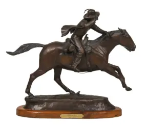 Bronze statue of a jockey riding a galloping horse on a wooden base, dynamic motion captured in mid-leap