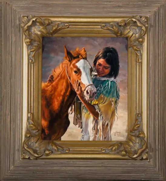 Framed painting of a girl in a fringed turquoise shawl stroking a chestnut horse.