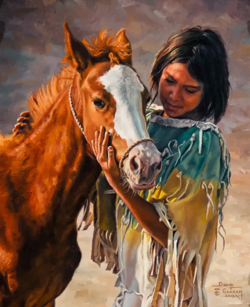 A girl in a fringed turquoise dress gently holding a brown horse with a white blaze on its face.