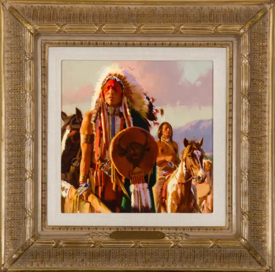 Framed portrait of Indigenous people in traditional clothing, set in an ornate gold frame.
