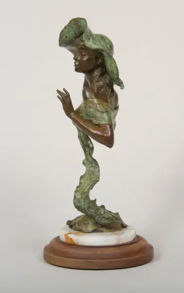 Bronze sculpture of a woman wearing a wide green hat, standing in a twisting pose on a marble-and-wood base.