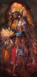 Portrait of a Native American man in a large feathered headdress and beadwork ceremonial attire.