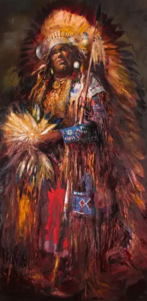 Portrait of a Native American man in a large feathered headdress and beadwork ceremonial attire.