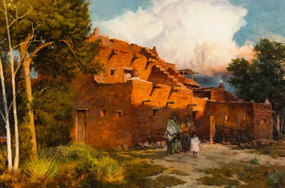 Group of people standing in front of a rustic red adobe building with steps, surrounded by trees in a warm, sunlit scene