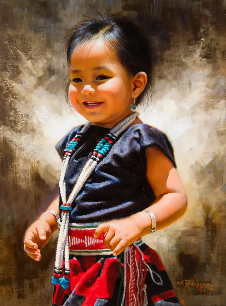 Smiling young girl in dark top wearing turquoise and red beaded jewelry and earrings, posed against a textured background.