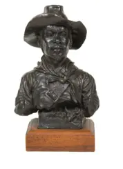 Bronze bust of a Buffalo Soldier wearing a wide-brimmed hat and scarf, mounted on a wooden display base.
