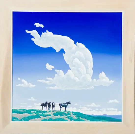 A framed landscape painting showing four horses standing on a green hill under a bright blue sky with a large white cloud formation above them