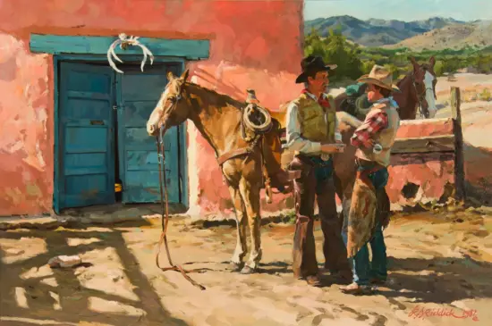 Two cowboys talk beside a saddled horse outside a pink adobe building with a turquoise door.
