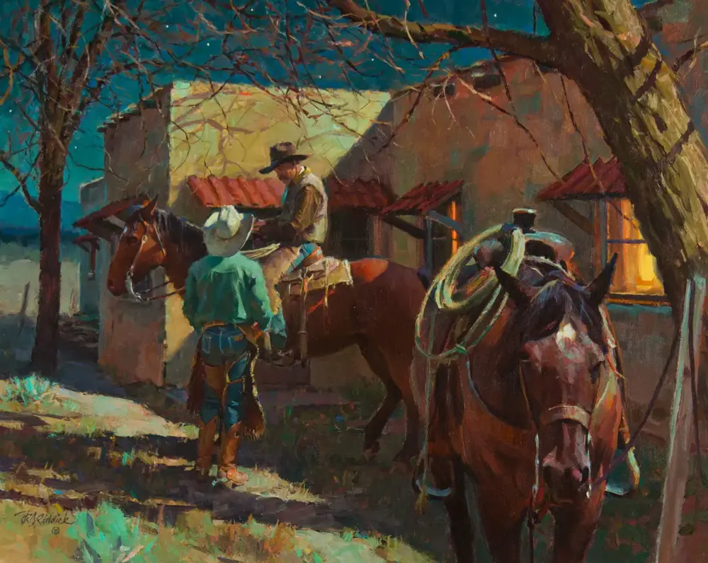 Cowboy on horseback speaks with a standing man beside a brown horse outside adobe huts under a leafy tree.