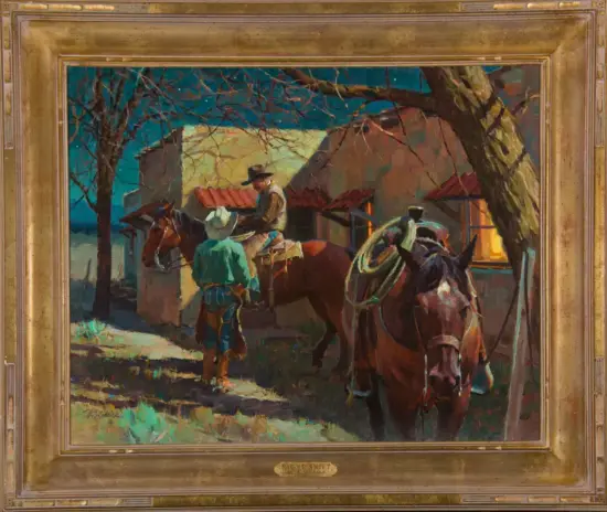 Two cowboys with horses near a rustic adobe building at dusk, one rider seated on a horse while another man stands nearby in green shirt.