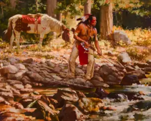 Native American man in traditional dress with bow wading a rocky stream in a forest; horse tied nearby in the background by trees.