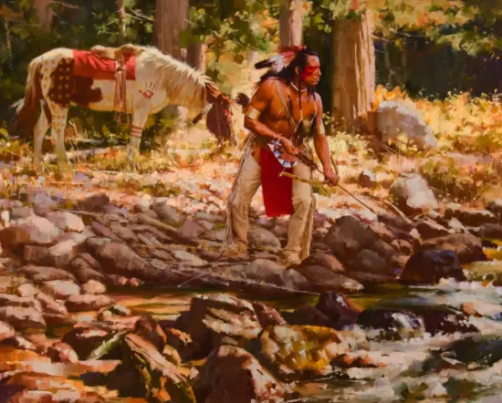 Native American man in traditional dress with bow wading a rocky stream in a forest; horse tied nearby in the background by trees.