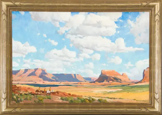 Framed oil painting of a desert landscape with red rock mesas under a bright blue sky and white clouds; a small group on horseback in the foreground.