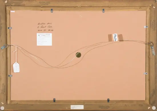 Back of framed artwork showing hanging wire, labels, and handwritten notes on the backing board.