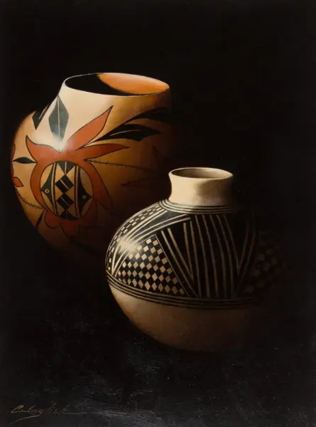 Two ceramic vases on a dark background; one black-and-white geometric patterned pot and a larger orange pot with a floral design.